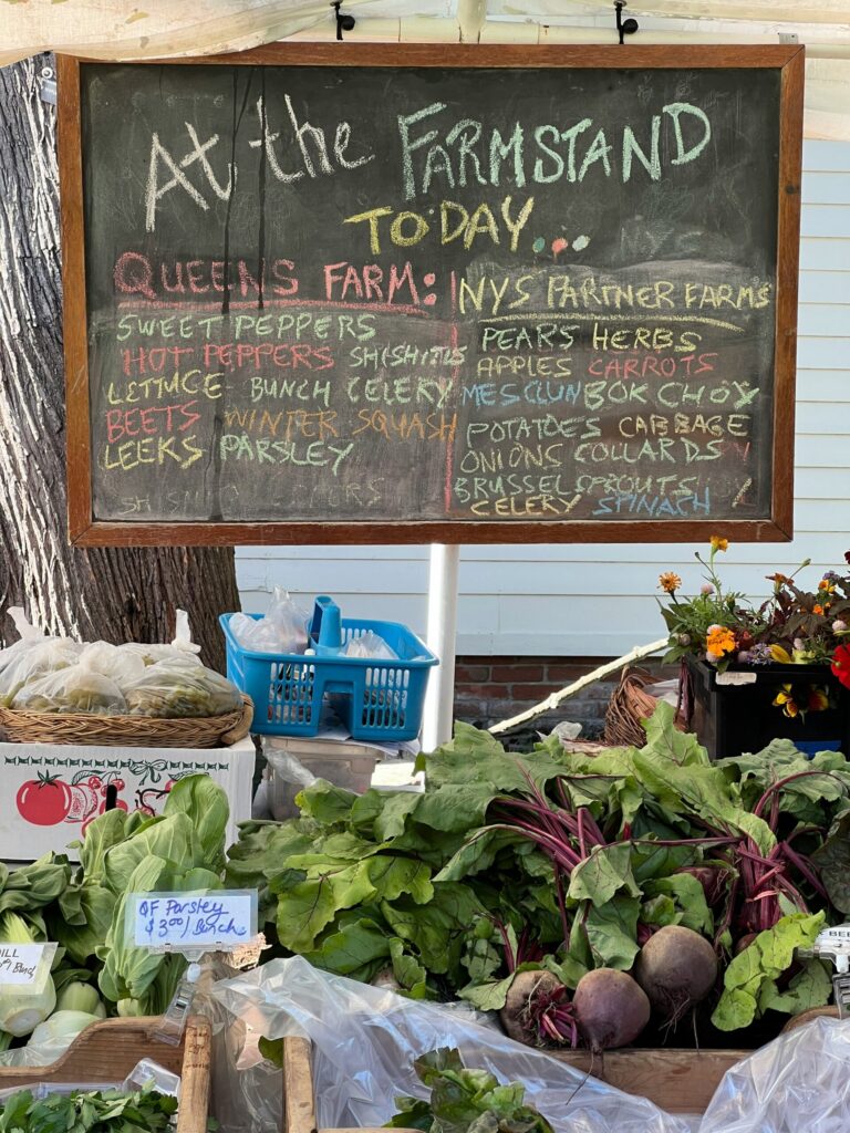 Farmer’s market stall displaying fresh, locally grown organic produce