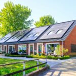 Modern eco-friendly home with solar panels, rainwater harvesting, set in a green landscape