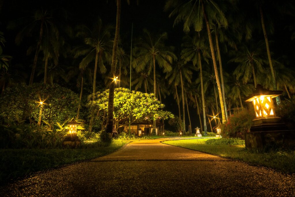 Solar path lights illuminating a garden walkway