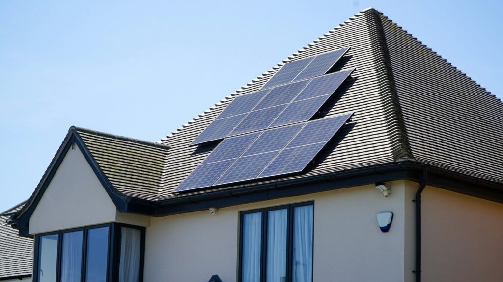 Solar panels on a residential rooftop, powering a carbon-neutral home