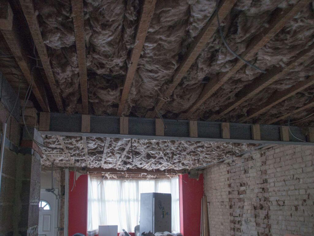 installing insulation in a home promoting energy efficiency