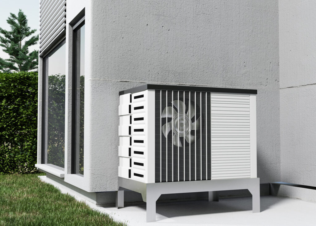 Outdoor heat pump unit next to a sustainable home, promoting carbon neutrality